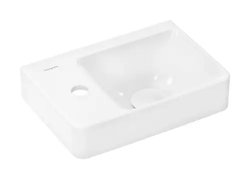 Weißes Waschbecken von Hansgrohe mit rechteckiger Form und einer Ablagefläche auf der linken Seite. Hahnloch vorhanden, jedoch ohne Überlauf.